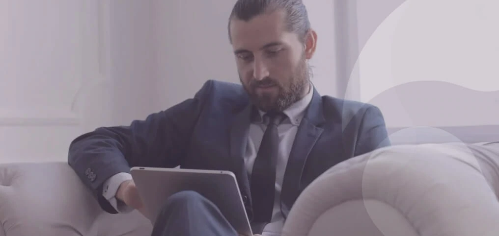 businessman reading something on tablet