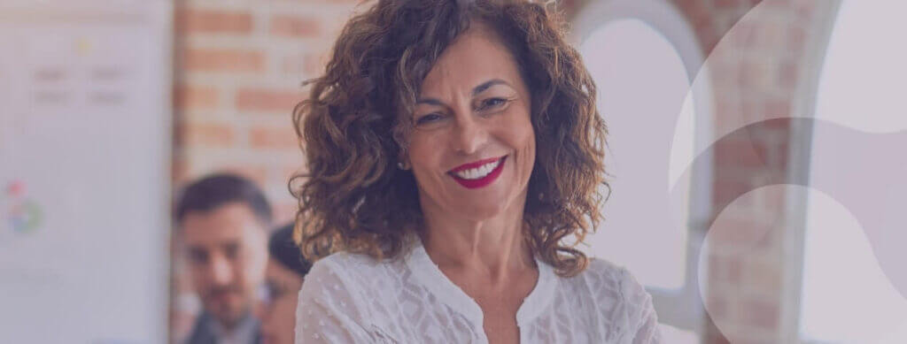 mature woman with beautiful curly hair smiling
