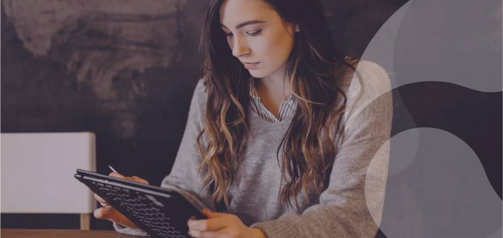 young woman reading something on her tablet
