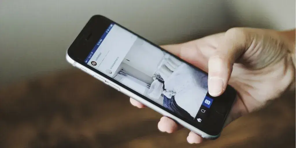 phone in hand, social media on screen