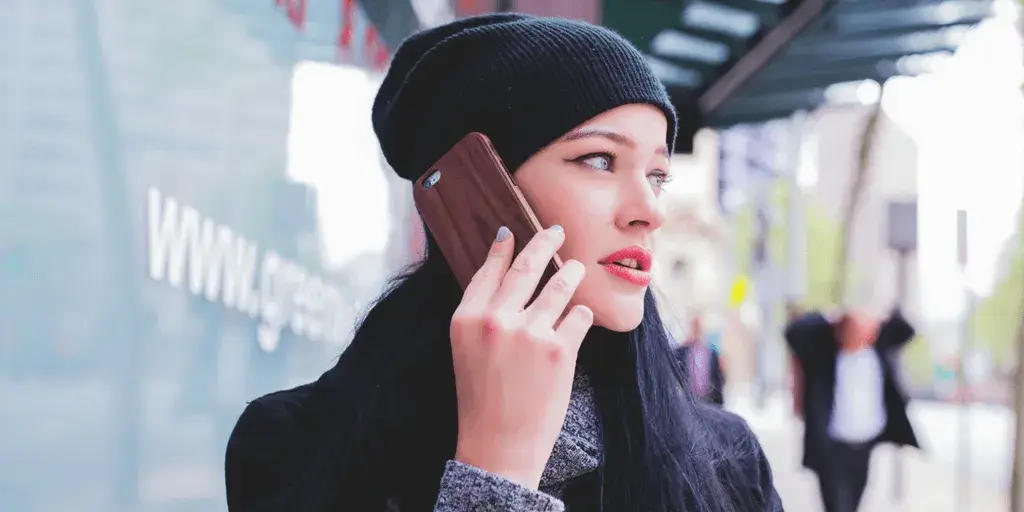 a young woman talking on the phone