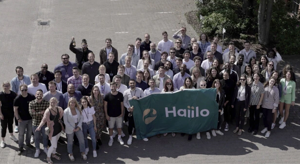 haiilo employees posing outside for a group photo