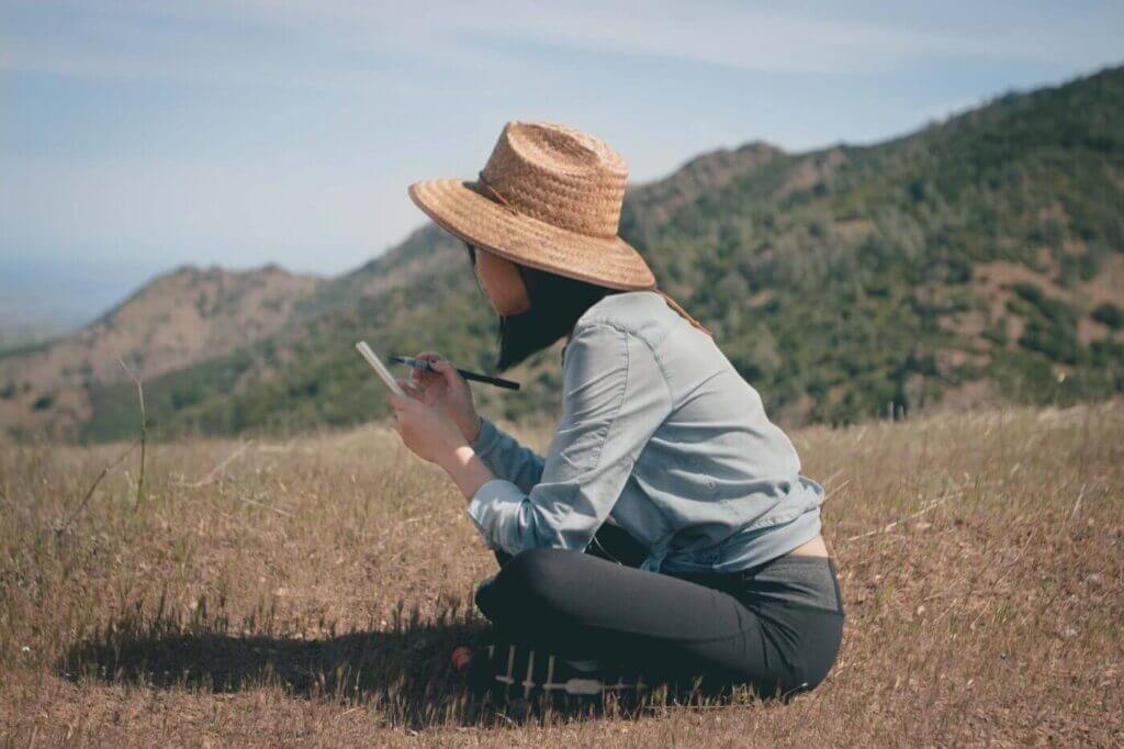 woman sitting outside in nature