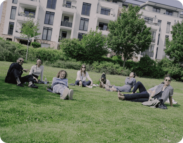 group of young people sitting on grass