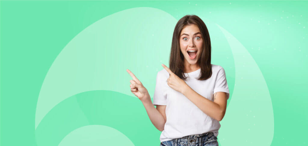 woman looks very excited, pointing with fingers up